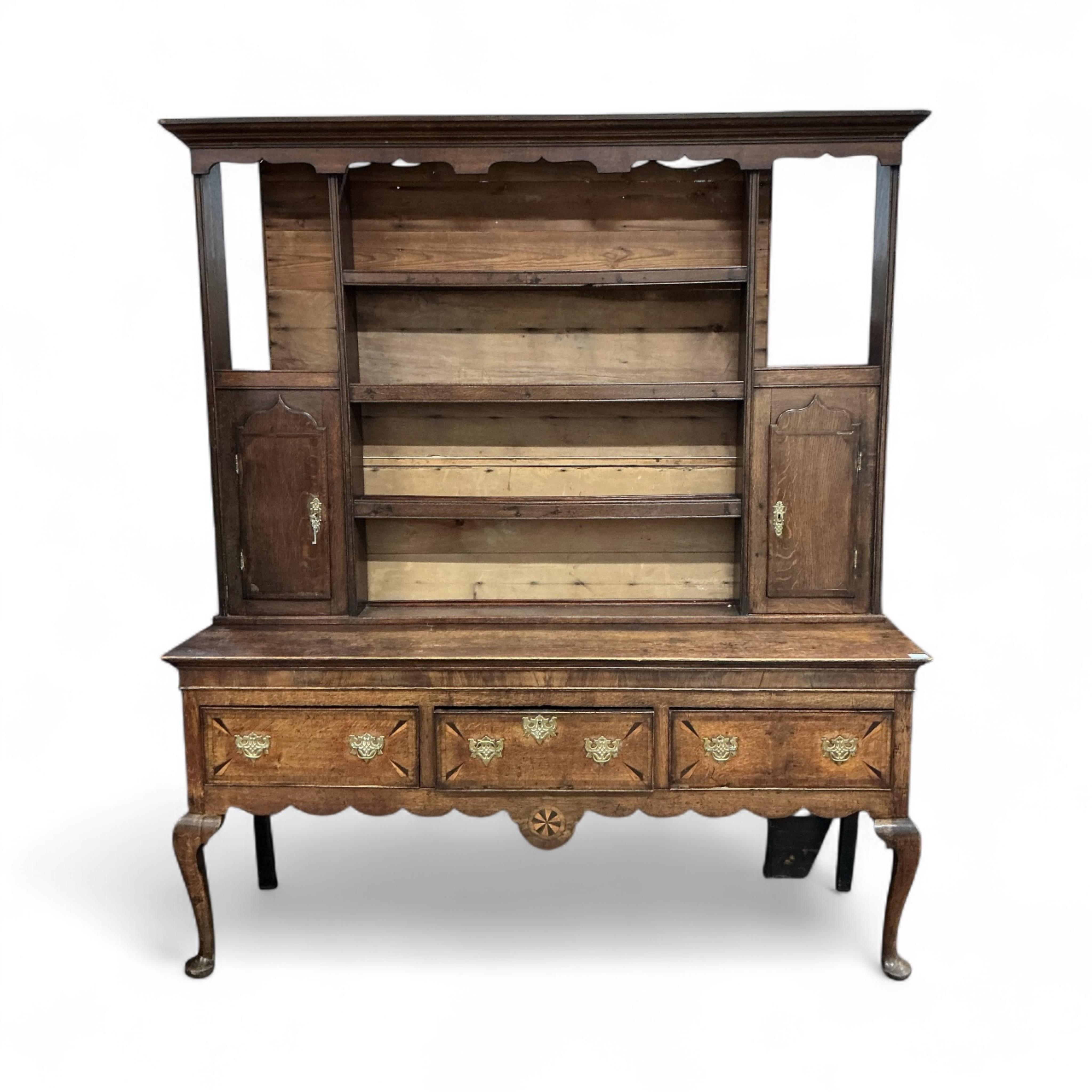 An 18th century inlaid oak dresser, width 183cm, depth 49cm, height 213cm